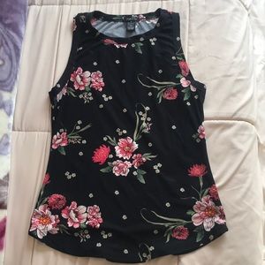 A black girls top with a floral pattern, VERY SOFT